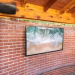 Outdoor Sunbrite TV on a brick wall